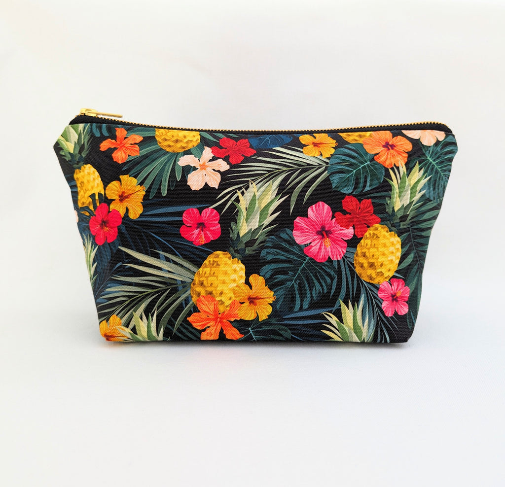 Large Toiletry Wash Bag for women featuring Tropical Pineapple Floral Print, with a quality brass YKK zip, sitting upright and closed, with zip to the left, with a boxed bottom, on a white background.
