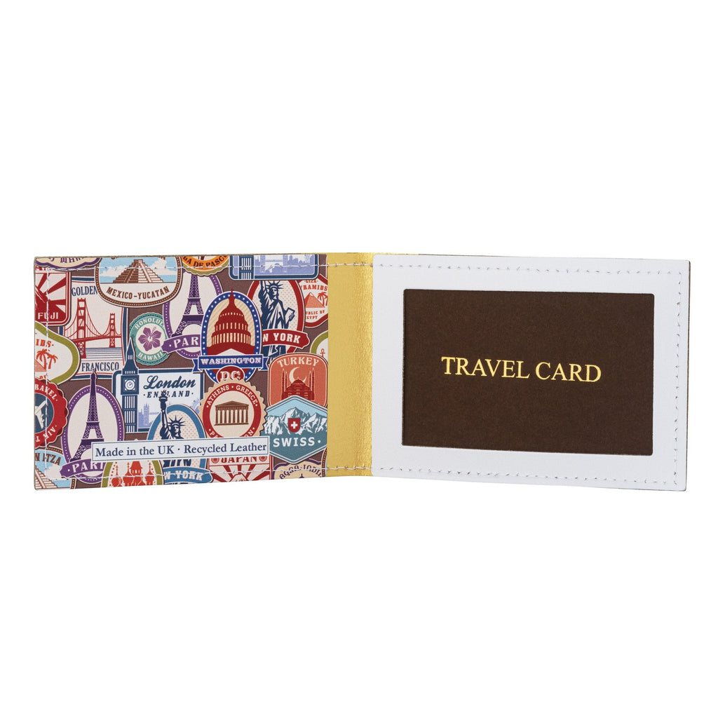 A recycled leather travel card holder featuring a travel themed print pattern, standing up, open, on a white background.