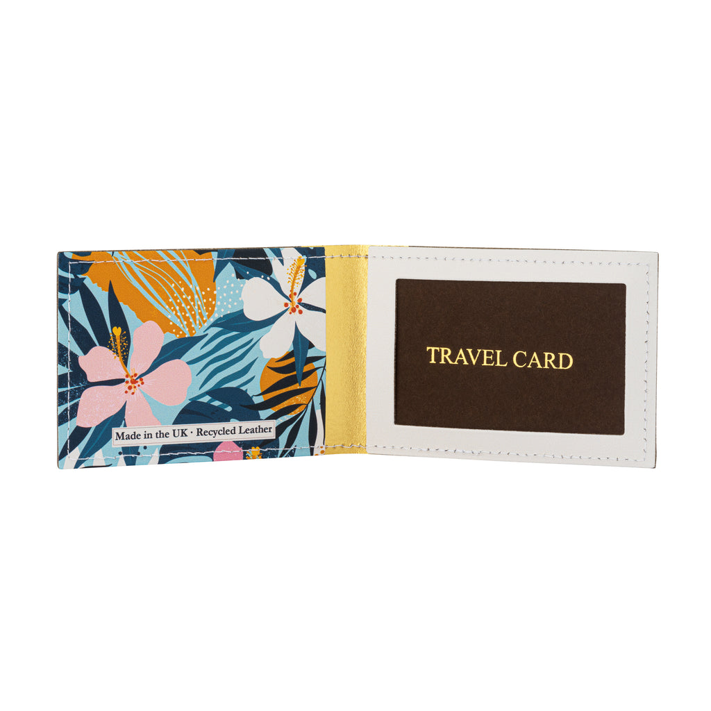 A recycled leather travel card holder featuring a tropical floral print pattern, standing open and upright on a white background.