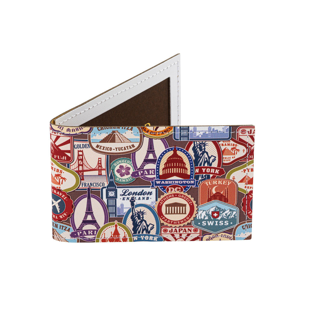 A recycled leather travel card holder featuring a travel themed print pattern, standing up on a white background.