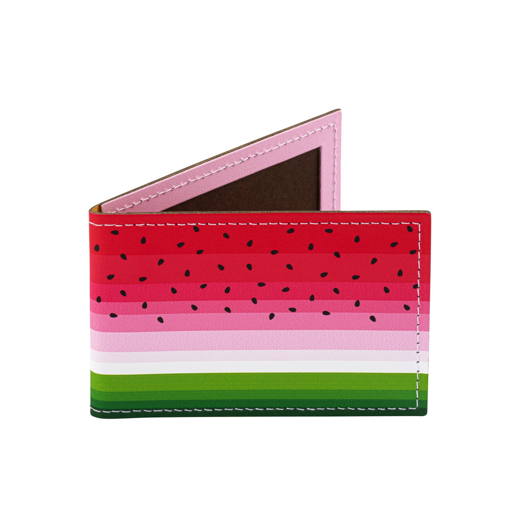 A recycled leather travel card holder featuring a brightly coloured watermelon print pattern, standing, on a white background.