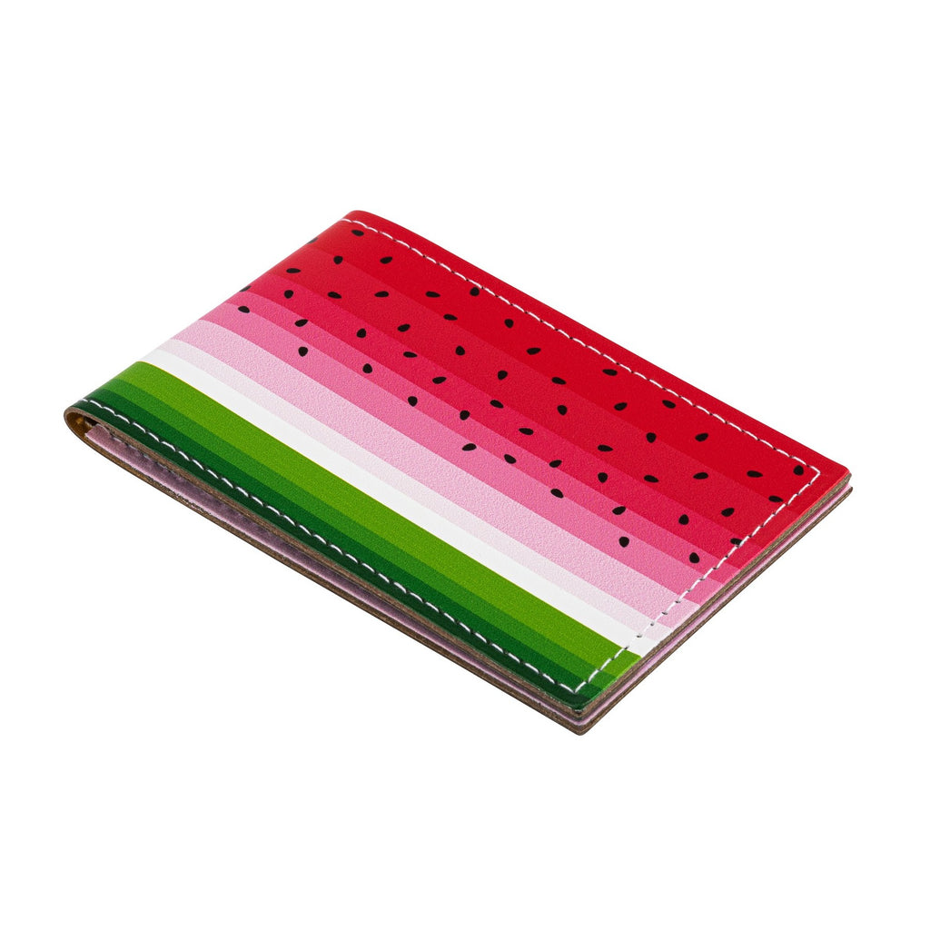 A side view of a recycled leather travel card holder featuring a brightly coloured watermelon print pattern, closed, on a white background.