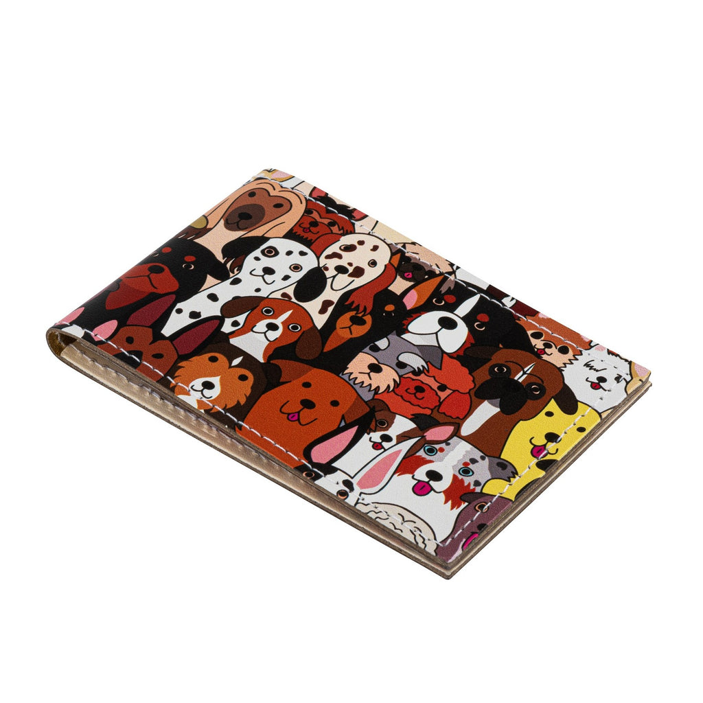 Side view of a recycled leather travel card holder featuring a cute dog print pattern, on a white background.