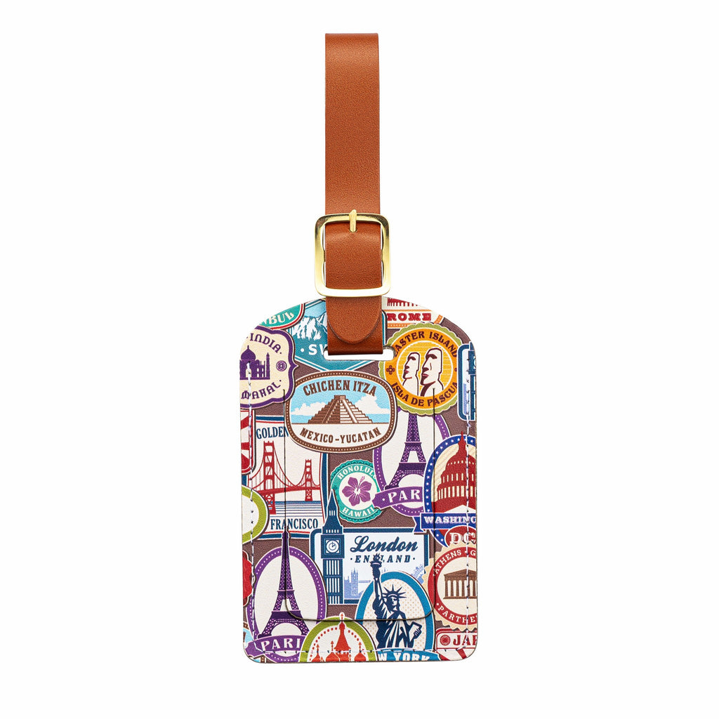 Recycled Leather Luggage Tag featuring travel themed print pattern, with flap covering personal details card, with a brown strap finished with a sleek gold-plated buckle to attach to luggage, on a white background.