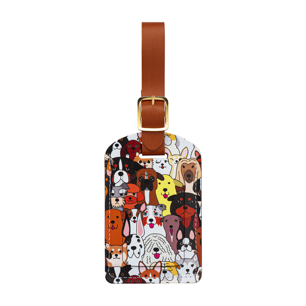 Recycled Leather Luggage Tag featuring dog themed print pattern, with flap covering personal details card, with a brown strap finished with a sleek gold-plated buckle to attach to luggage, on a white background.
