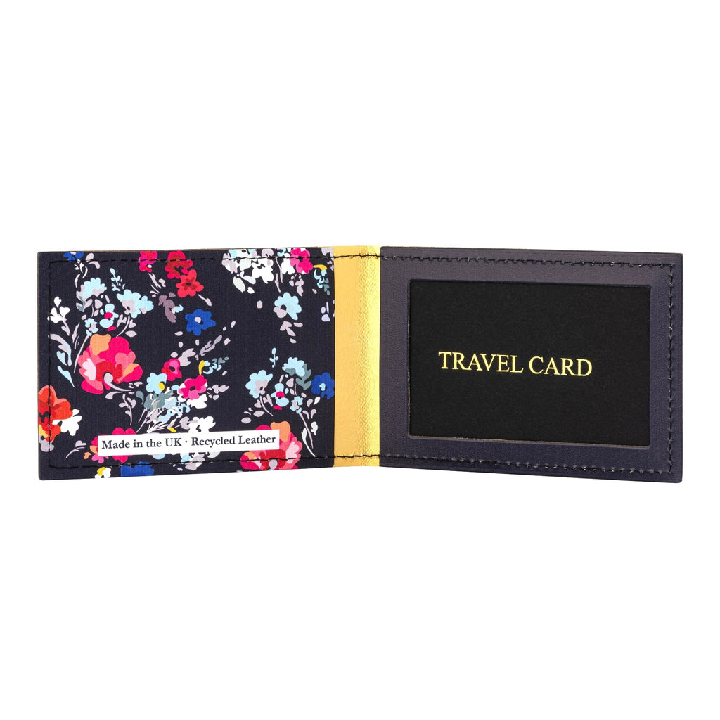 Recycled Leather Travel Card Holder featuring a dark blue floral print pattern, standing open, on a white background.