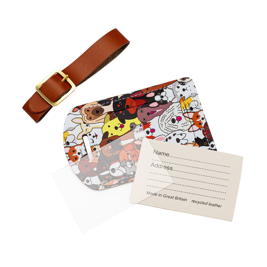 Recycled Leather Luggage Tag featuring dog themed print pattern, in parts, including a tag, a brown strap finished with a sleek gold-plated buckle, an address card and a plastic address card cover, all on a white background.