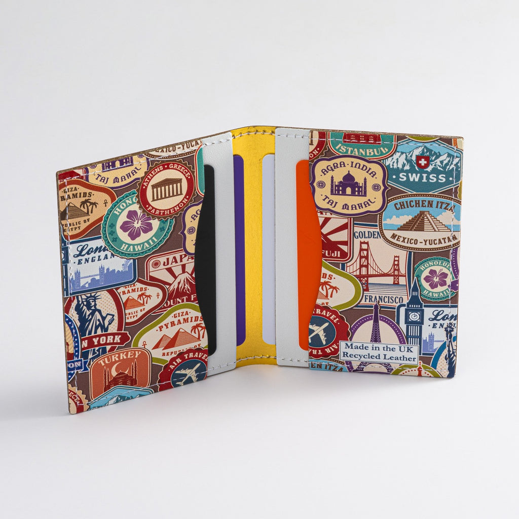 Recycled Leather Folding Wallet Card Holder featuring travel themed print, with four slots, with cards in, on a white background.