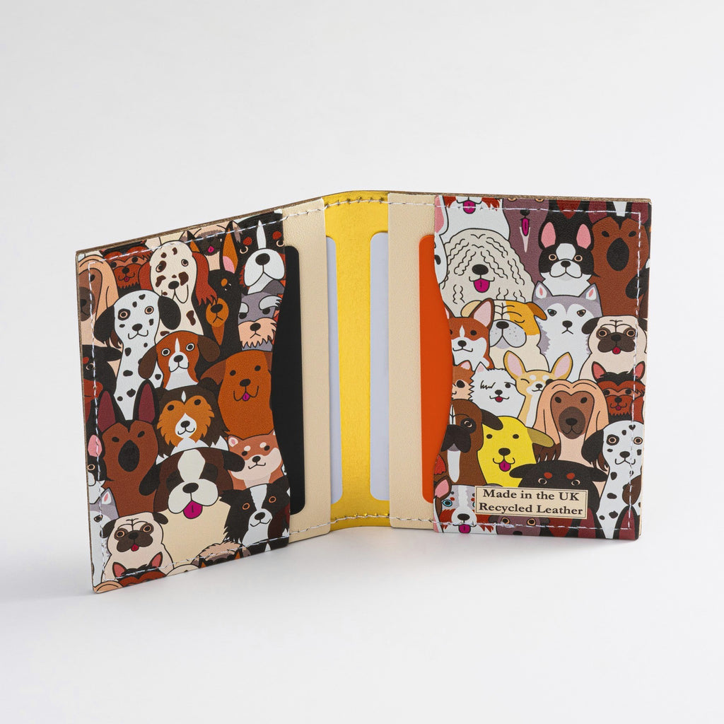 Recycled Leather Folding Wallet Card Holder featuring dog themed print, with four slots with cards in, on a white background.