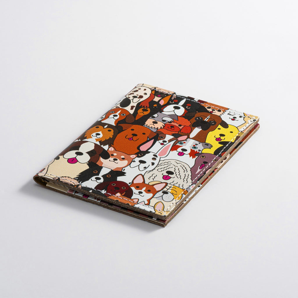 Recycled Leather Folding Wallet Card Holder featuring dog themed print, closed, on a white background.