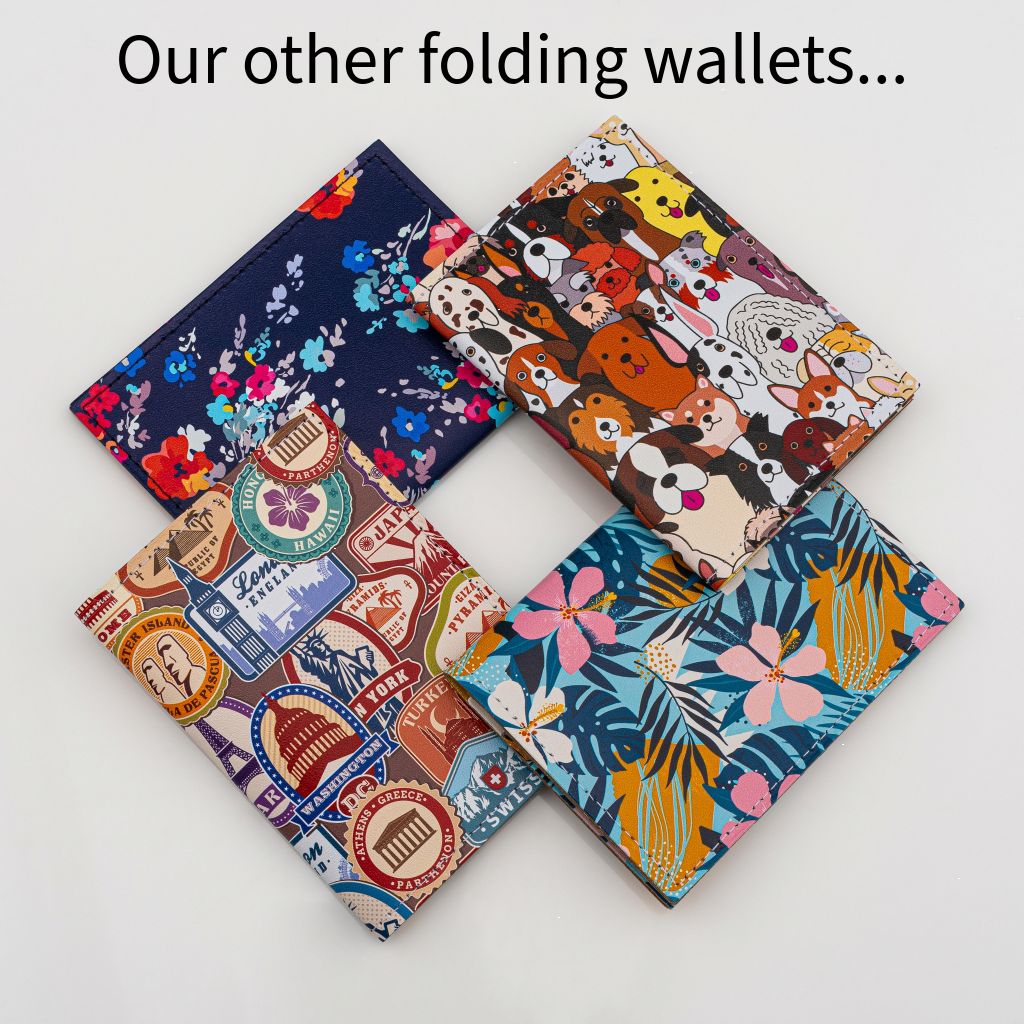 Four recycled leather folding wallet card holders, one with a dog print, one with a travel themed print, one with a tropical floral print and one with a floral print on a dark navy blue background, all on a white background.